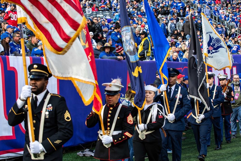 USS Arlington Sailors and Marines participate in pregame ceremonies