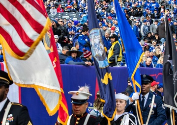 USS Arlington Sailors and Marines participate in pregame ceremonies