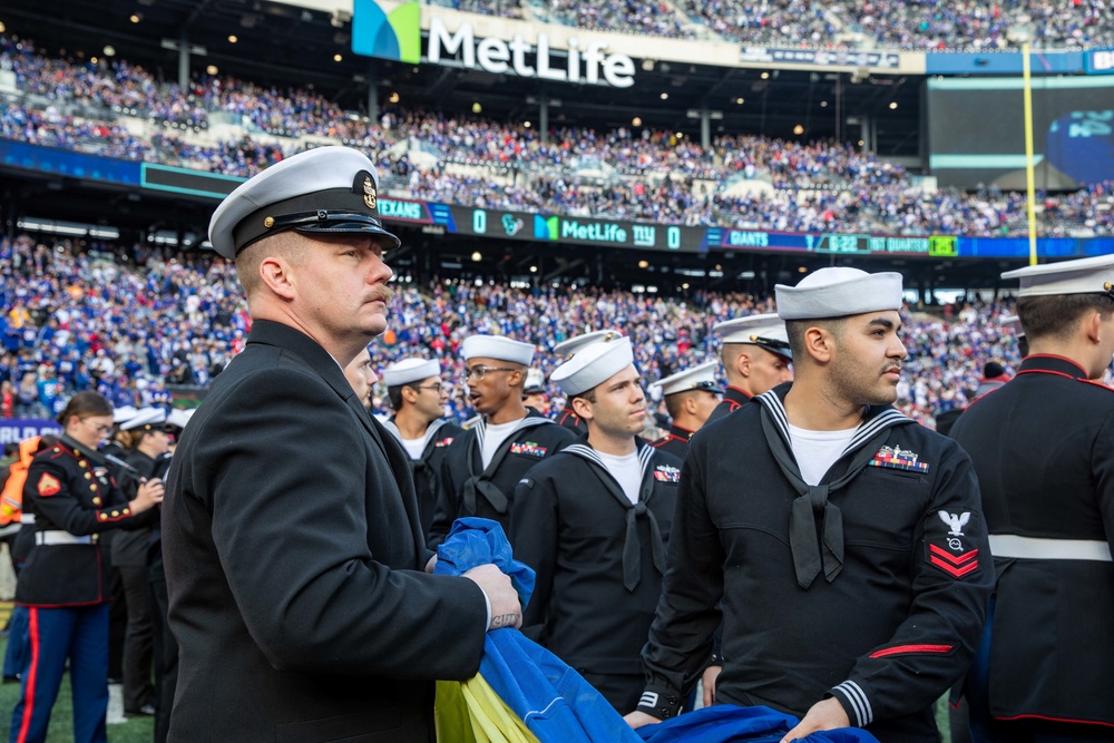 USS Arlington Sailors and Marines participate in pregame ceremonies