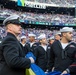 USS Arlington Sailors and Marines participate in pregame ceremonies