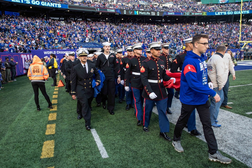 USS Arlington Sailors and Marines participate in pregame ceremonies