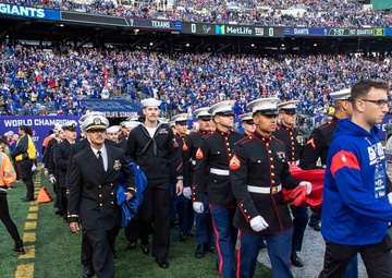 USS Arlington Sailors and Marines participate in pregame ceremonies