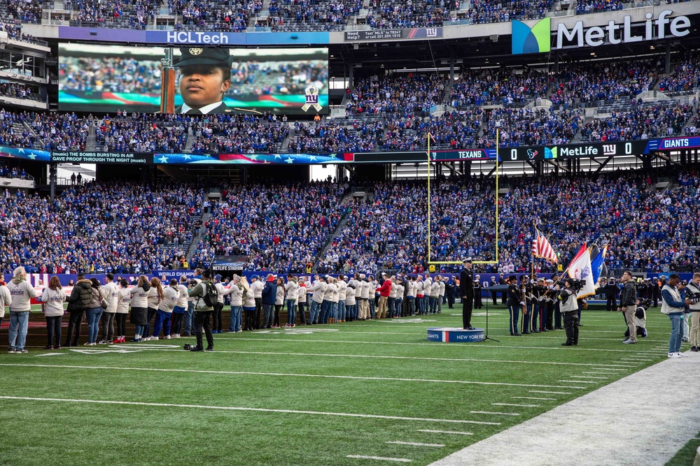 USS Arlington Sailors and Marines participate in pregame ceremonies