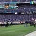 USS Arlington Sailors and Marines participate in pregame ceremonies