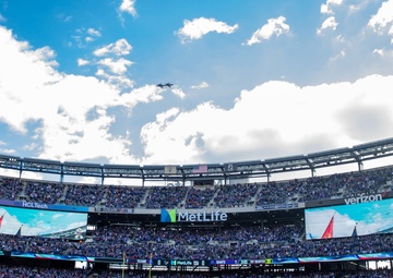 USS Arlington Sailors and Marines participate in pregame ceremonies