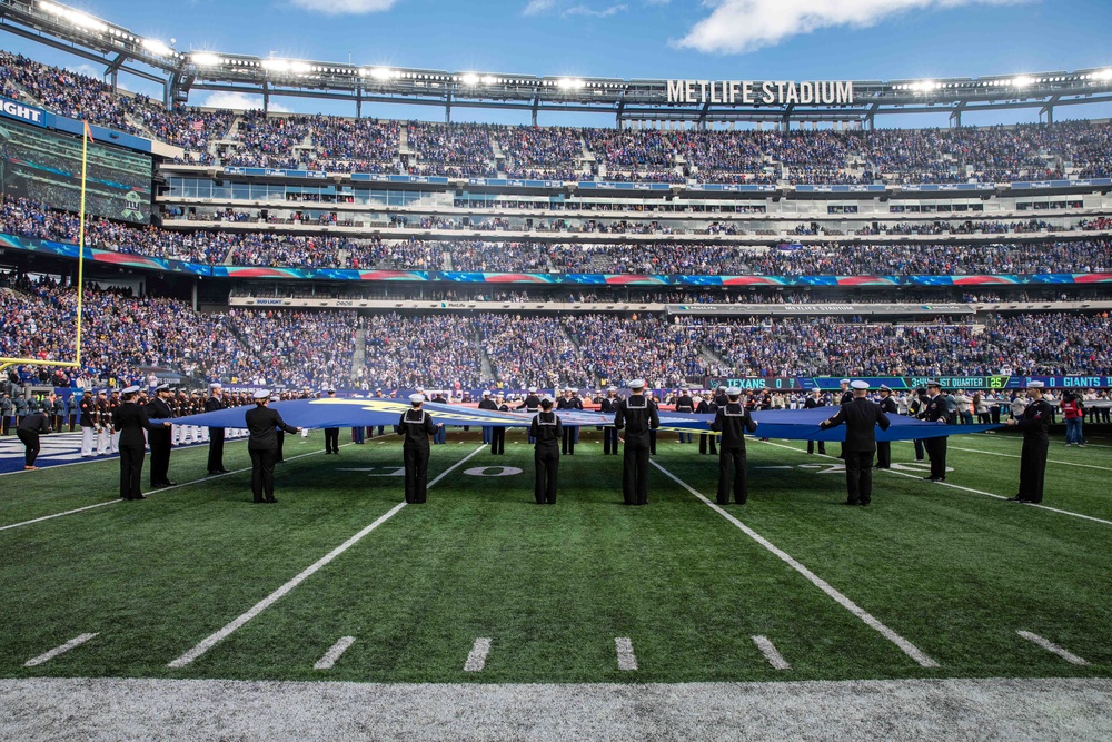 USS Arlington Sailors and Marines participate in pregame ceremonies