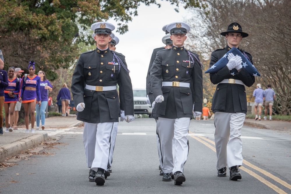 Formation of cadets carrying the flag