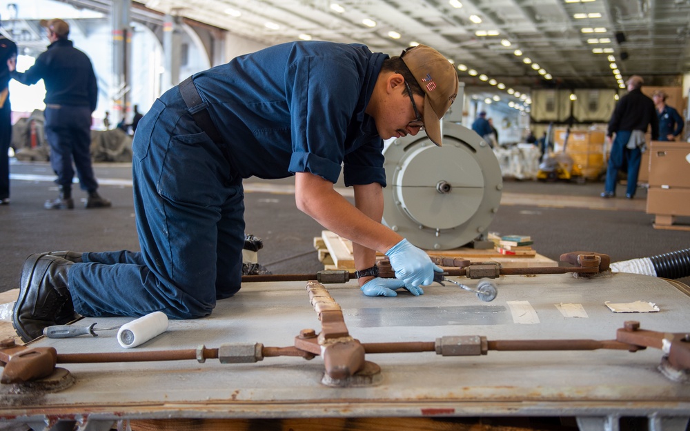 USS Carl Vinson (CVN 70) Sailor Conducts Maintenance
