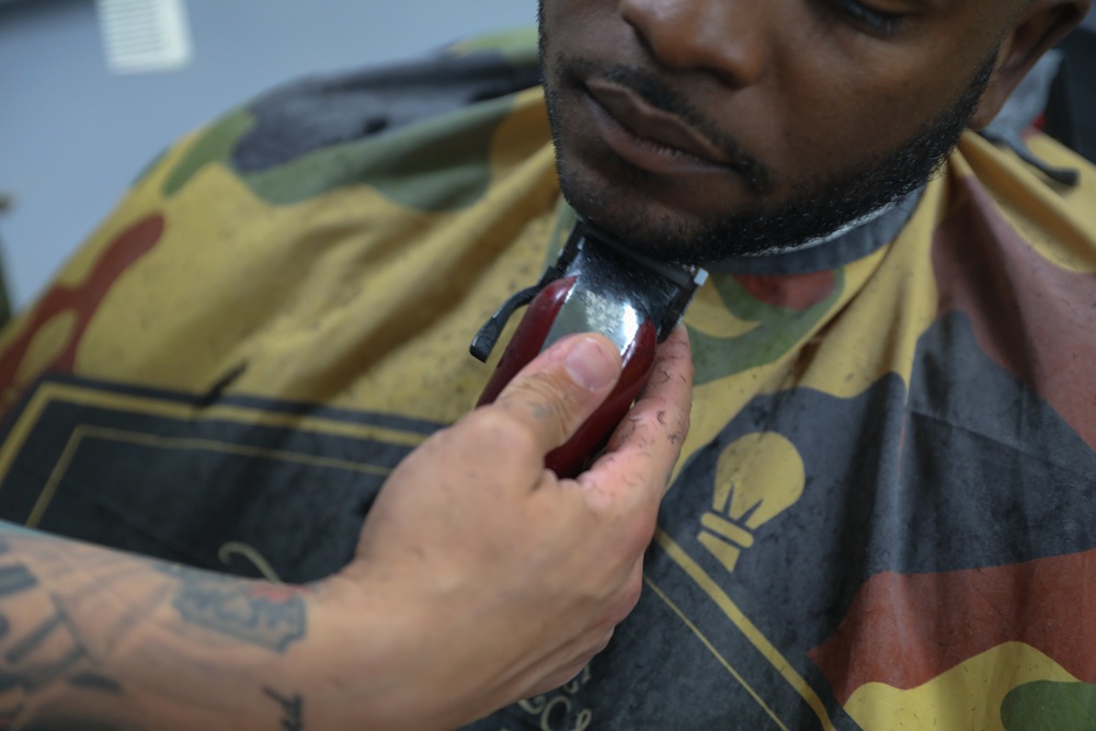 The world of barbering helps one Sergeant with the 369th Sustainment Brigade lead Soldiers