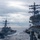 USS Ronald Reagan (CVN 76) conducts fueling-at-sea with USS Benfold (DDG 65)