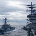 USS Ronald Reagan (CVN 76) conducts fueling-at-sea with USS Benfold (DDG 65)