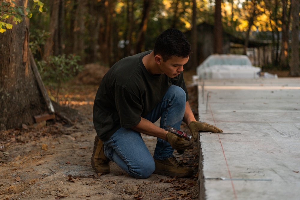 Airmen volunteer with local Habitat for Humanity