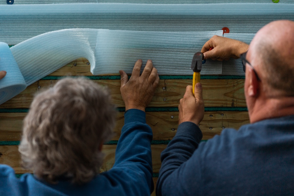 Airmen volunteer with local Habitat for Humanity