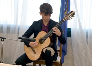 SPC Rory Garcia Plays Original Songs For Troops