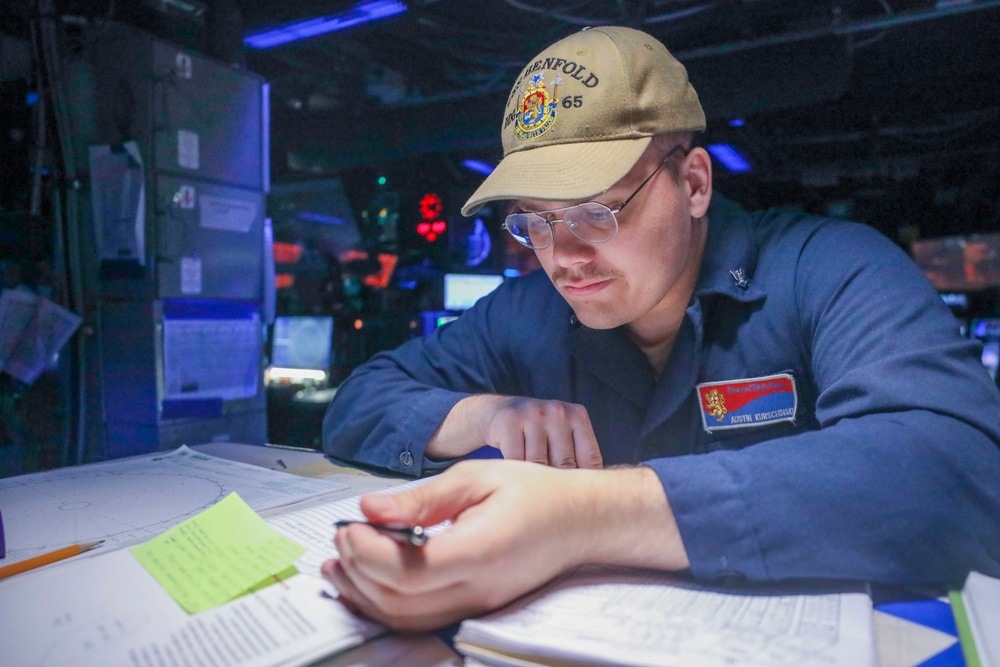 Operations Specialist Maintains Logs During Keen Sword