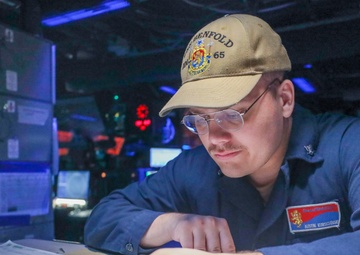 Operations Specialist Maintains Logs During Keen Sword