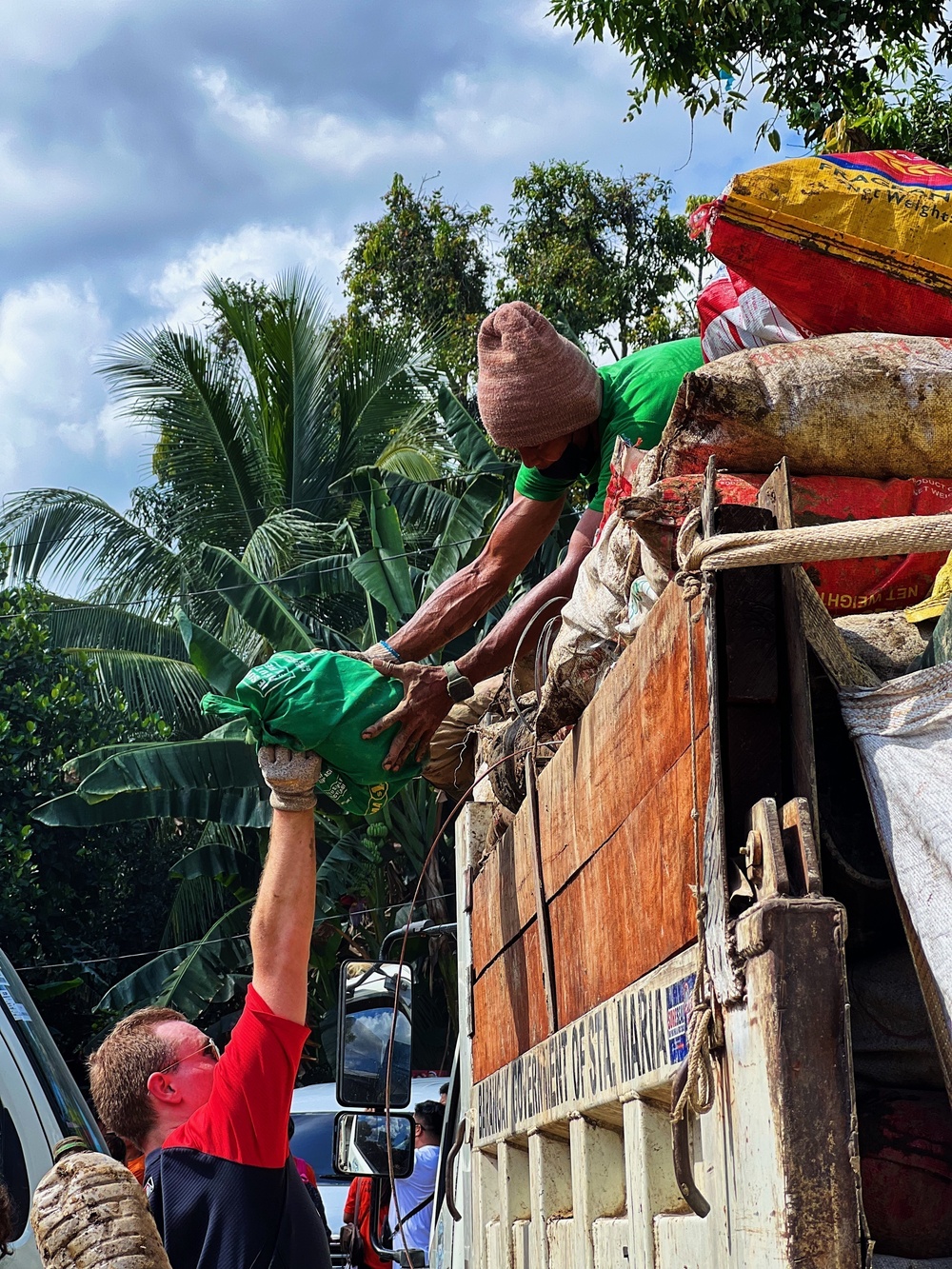 City Officials, Security Force Personnel Clean Up Flooded Zamboanga