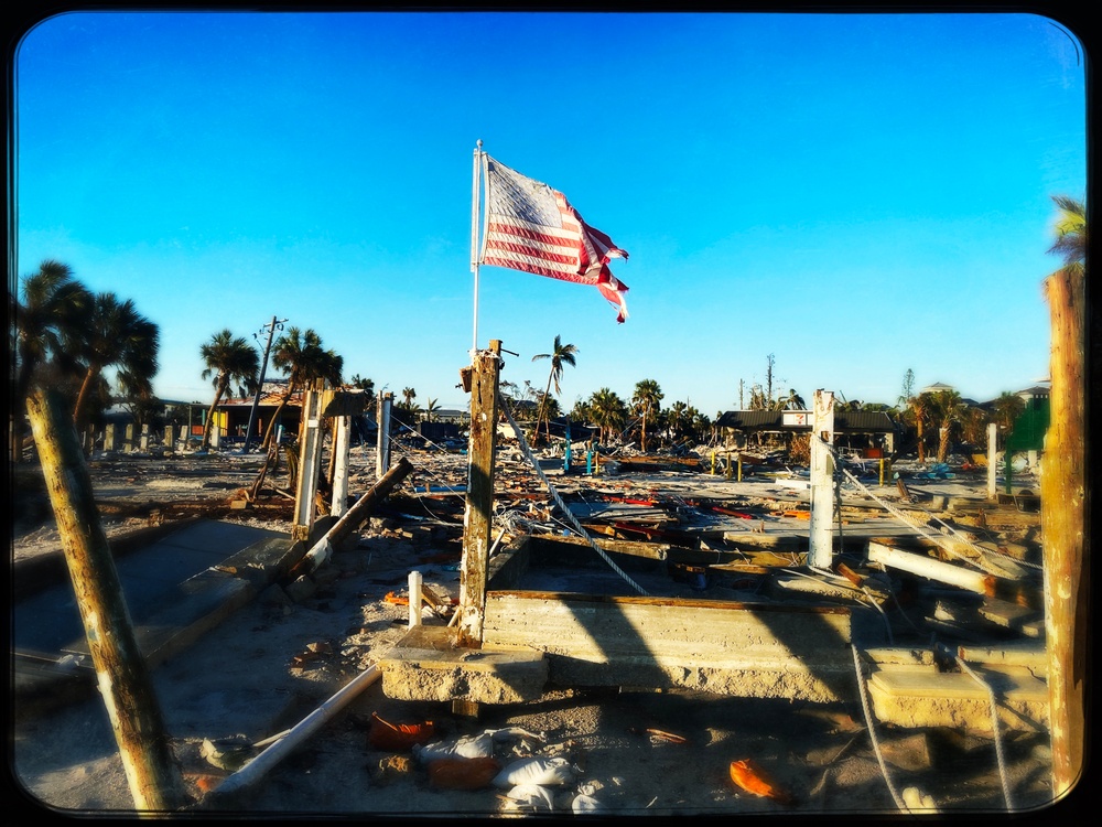 A Flag Blows in the Wind Amid Damage From Hurricane Ian