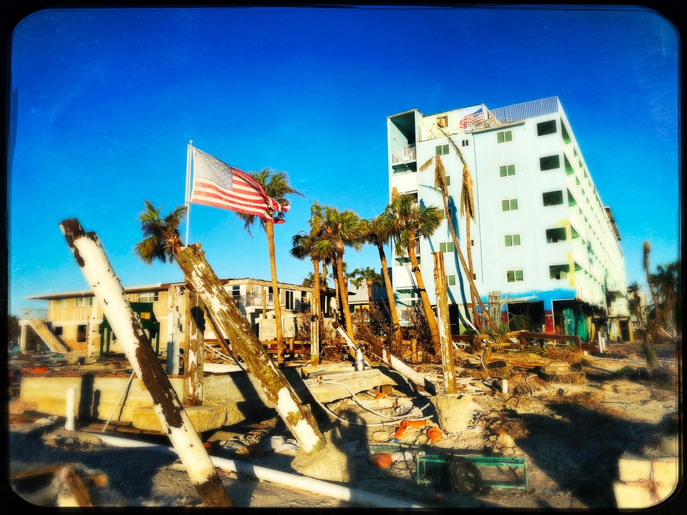 A Flag Blows in the Wind Amid Damage From Hurricane Ian