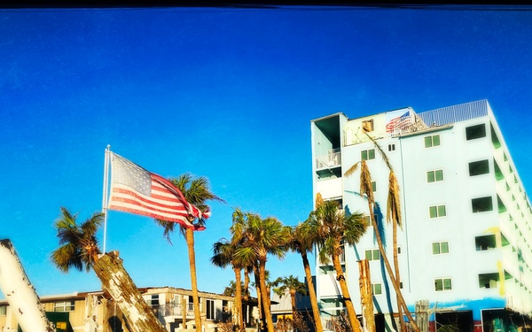 A Flag Blows in the Wind Amid Damage From Hurricane Ian