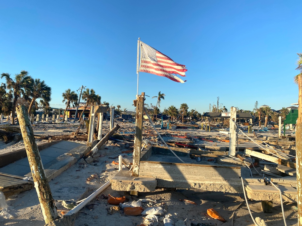 A Flag Blows in the Wind Amid Damage From Hurricane Ian