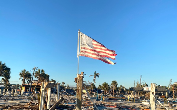 A Flag Blows in the Wind Amid Damage From Hurricane Ian