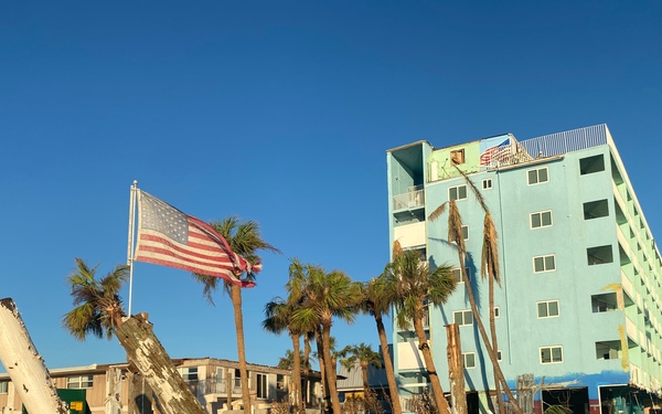 A Flag Blows in the Wind Amid Damage From Hurricane Ian