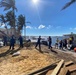 People Help Load Supplies on a Ferry to Pine Island