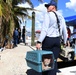 A Fire Fighter Helps Transport a Cat For a Local Resident