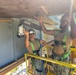 Seabees with Naval Mobile Construction Battalion 4 secure soffit to the Richardson Multipurpose Facility onboard U.S. Army Garrison - Kwajalein Atoll.