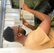 Equipment Operator 3rd Class Bobby Smith conducts tool inventory