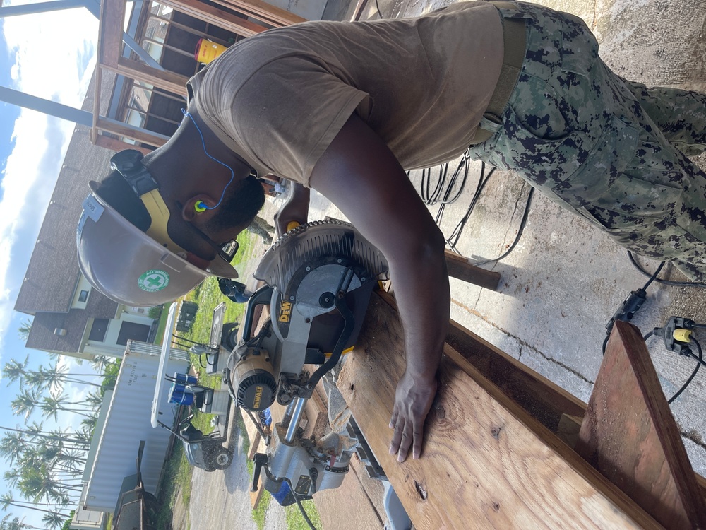 Equipment Operator 3rd Bobby Smith, cuts ceiling joists to be used for The Richardson Multipurpose Facility.