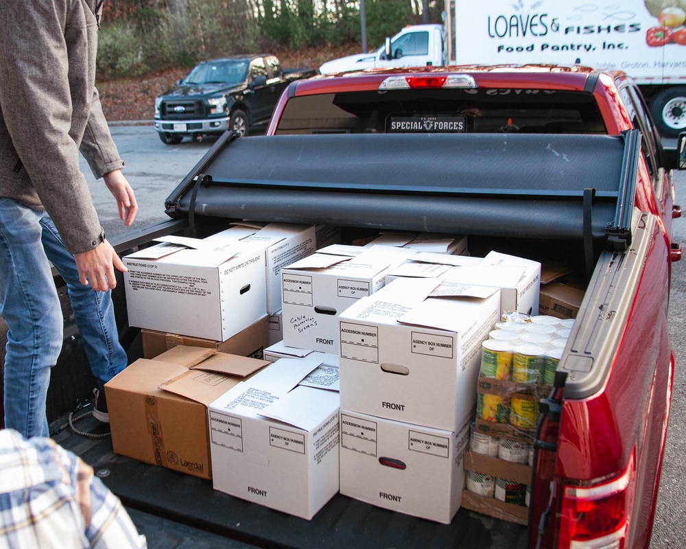 Non-perishable food donation items being dropped off at Loaves &amp; Fishes by USAG Devens RFTA staff.