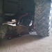 Construction Mechanic 2nd Class Tyler Miller, conducts maintenance on the 11k forklift.