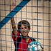 A boy waves to a US Civil Affairs team at al Hol camp