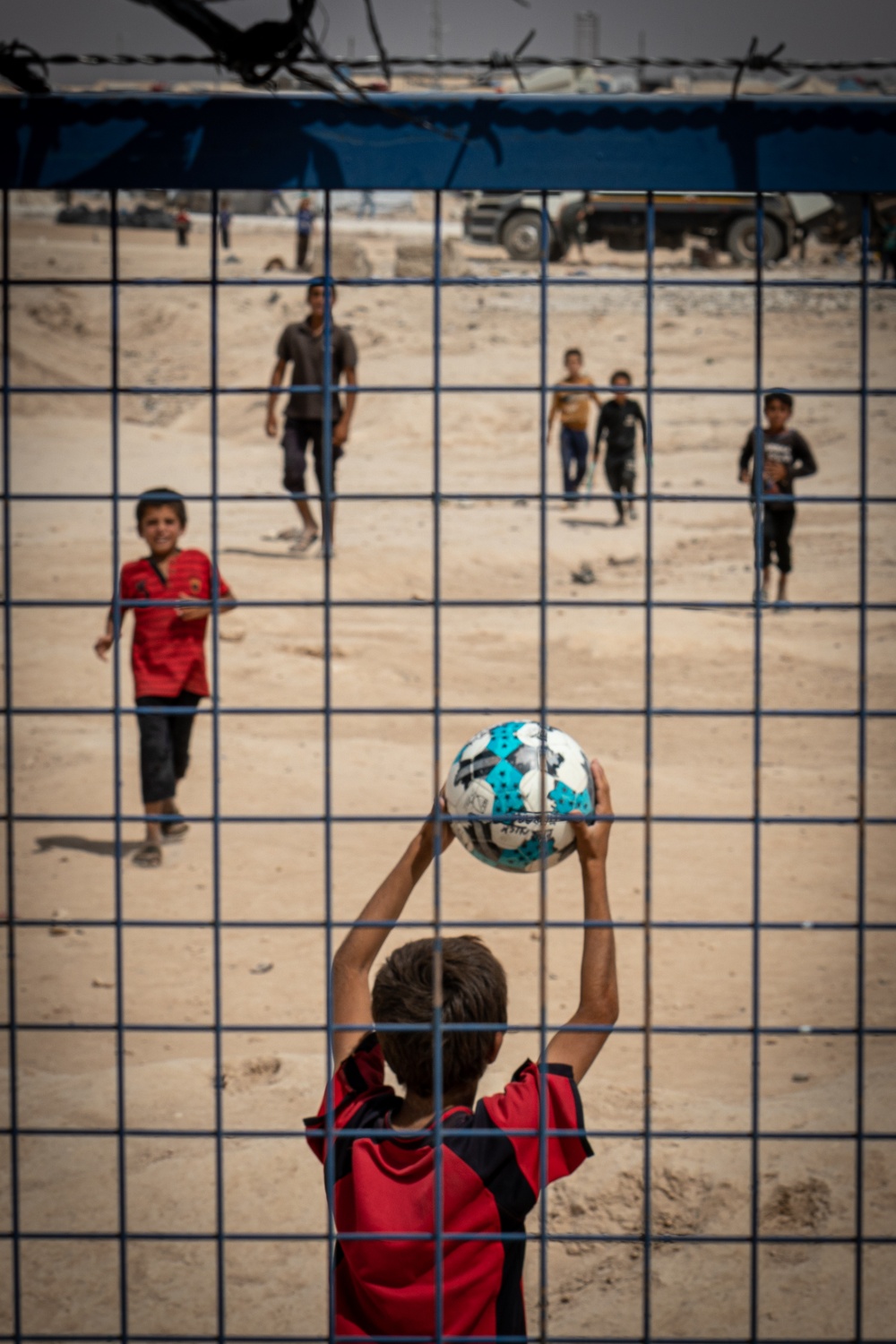 Children play soccer at al Hol camp