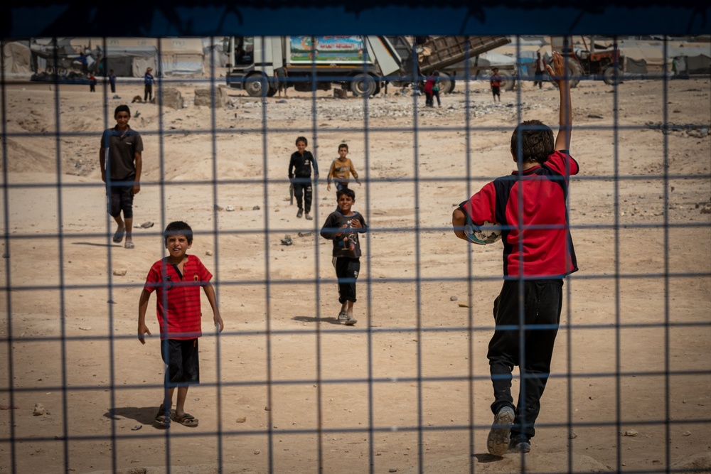 Children play soccer at the al Hol camp