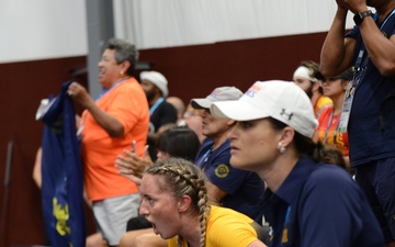 HM2 Sarah Rockhold cheering for Team Navy during indoor rowing competition at the 2022 Warrior Games