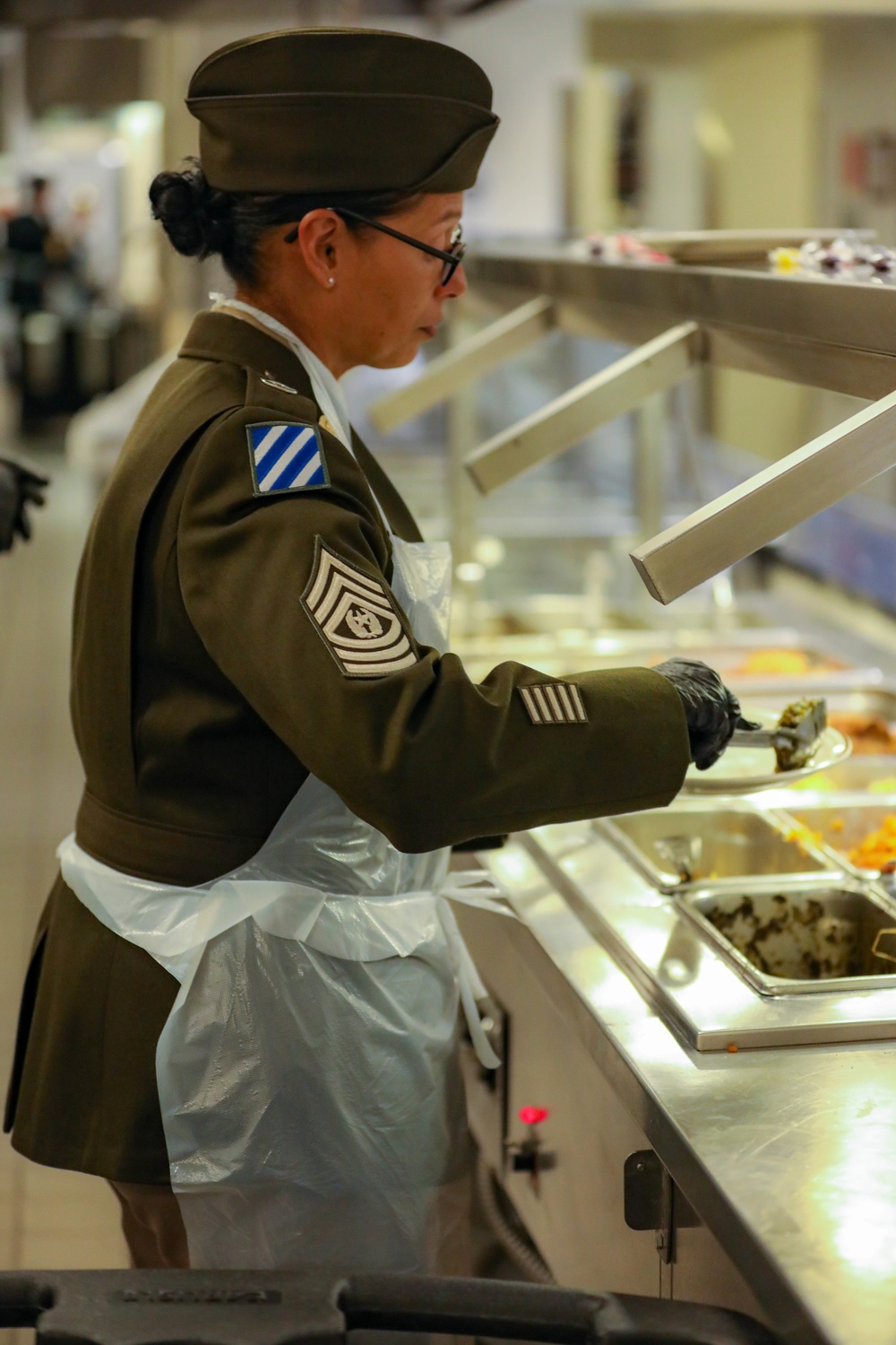 The 3rd Division Sustainment Brigade 3rd Infantry Division serves Soldiers a Thanksgiving holiday meal