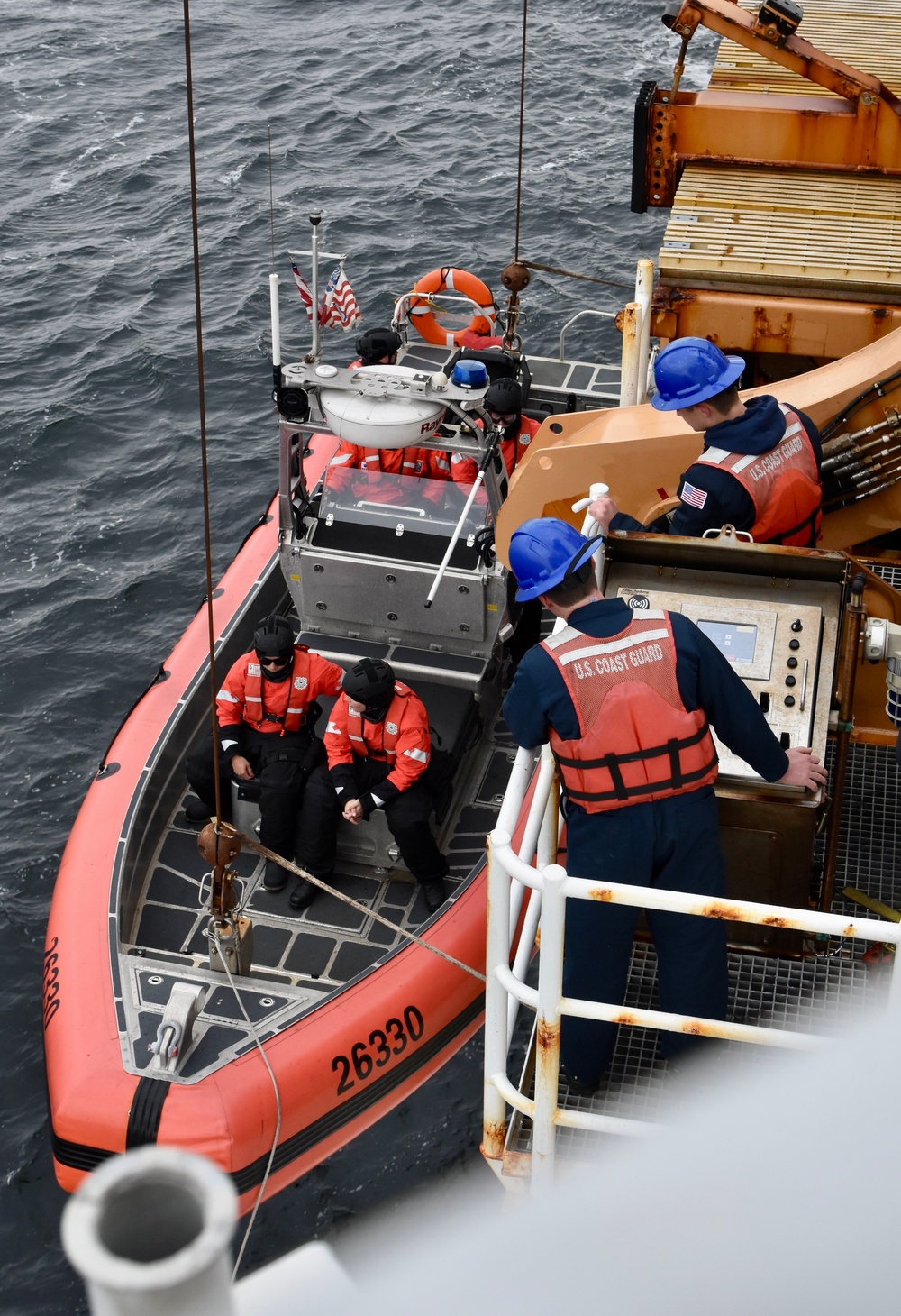 USCGC Hamilton personnel conduct small boat pursuit training while operating in the Baltic Sea