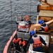 USCGC Hamilton personnel conduct small boat pursuit training while operating in the Baltic Sea