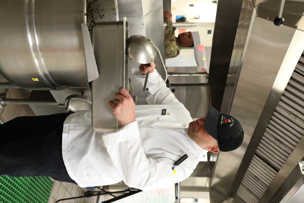 Culinary specialists cook meals for Thanksgiving celebration