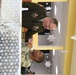 Commanding General gives well wishes to Soldier during Thanksgiving celebration