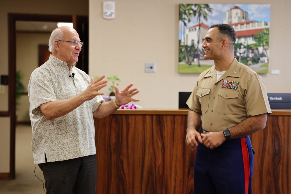 Cutting a cake in honor of the 247th birthday of the Marine Corps with the Mayor and city officials of Honolulu