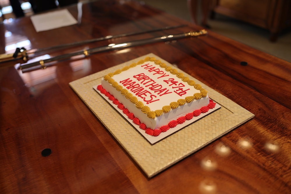 Cutting a cake in honor of the 247th birthday of the Marine Corps with the Mayor and city officials of Honolulu