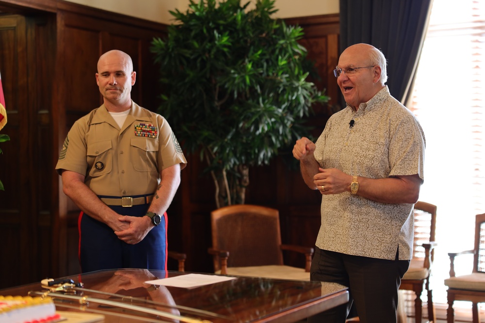 Cutting a cake in honor of the 247th birthday of the Marine Corps with the Mayor and city officials of Honolulu