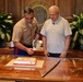 Cutting a cake in honor of the 247th birthday of the Marine Corps with the Mayor and city officials of Honolulu