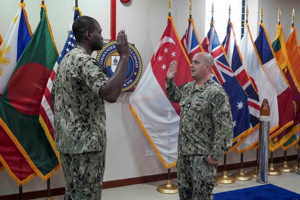 YN1 Thompson Re-enlists