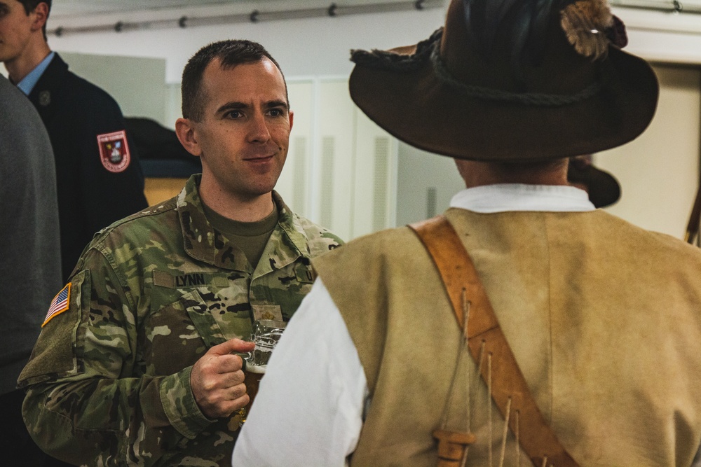 Soldiers with 41st FAB HHB BDE celebrate their new partnership with representatives from the community of Flossenbürg at Grafenwoehr, Germany