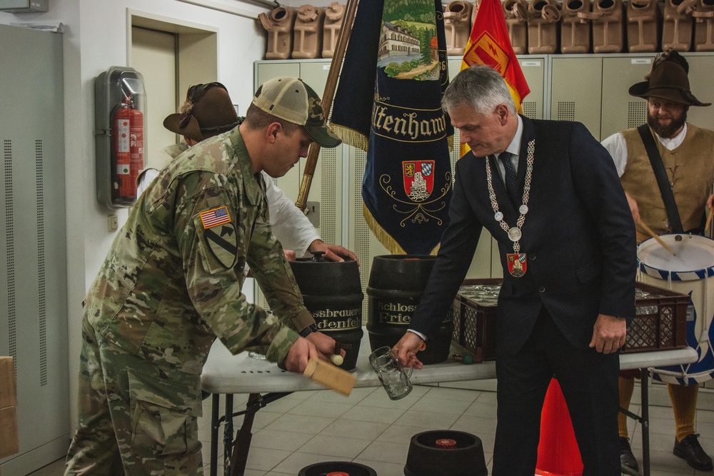 Soldiers with 41st FAB HHB BDE celebrate their new partnership with representatives from the community of Flossenbürg at Grafenwoehr, Germany